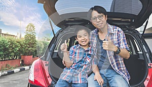 Happy family on a road trip, Sitting In Trunk Of Car