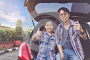 Happy family on a road trip, Sitting In Trunk Of Car