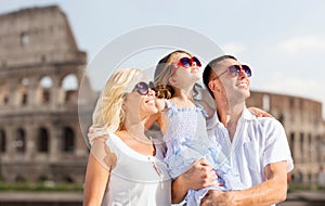 Happy family in rome over coliseum background