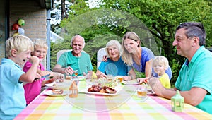 Happy family of seven having meal together