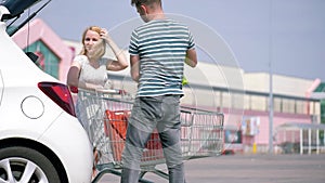 Happy family with shopping carts