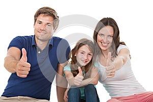 Happy family showing thumbs up together