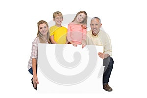 Happy family showing white card