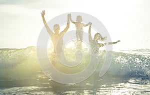 Happy family silhouette in the water