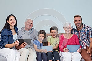 Happy family sitting on sofa