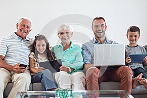 Happy family sitting on sofa