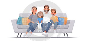 Happy family sitting on sofa over isolated background. Mom, dad, son and daughter are smiling while sitting on the couch. Concept