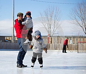 Happy family at the skating rink