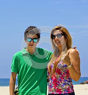 Happy family smiling at camera in muscle beach, California