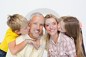 Happy family smiling and showing affection