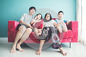 Happy family on sofa in the room