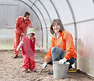 Happy family sows seeds