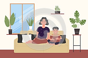 Happy family spend time at home, mother and child son read book and study together