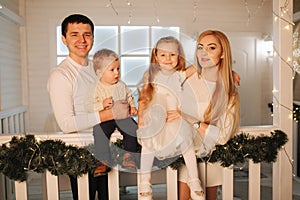 Happy family spend time together on Christmas.Portrait of Mom dad, Daughter and son on winter holiday