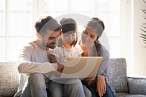 Happy family spending time at home browsing internet