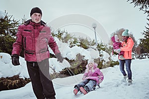 Happy family spending time outdoor in winter