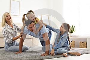 Happy family spending time together at home