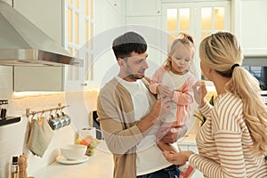 Happy family spending time together in kitchen