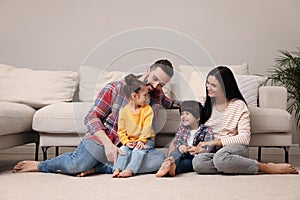 Happy family spending time together in living room