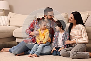 Happy family spending time together in living room