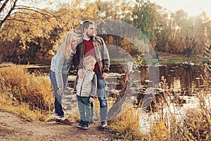 Happy family spending time together outdoor. Lifestyle capture, rural cozy scene