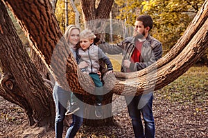 Happy family spending time together outdoor. Lifestyle capture, rural cozy scene