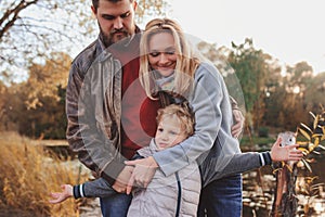 Happy family spending time together outdoor. Lifestyle capture, rural cozy scene