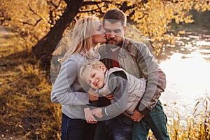 Happy family spending time together outdoor. Lifestyle capture, rural cozy scene