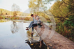 Happy family spending time together outdoor. Lifestyle capture, rural cozy scene