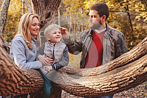 Happy family spending time together outdoor. Lifestyle capture, rural cozy scene