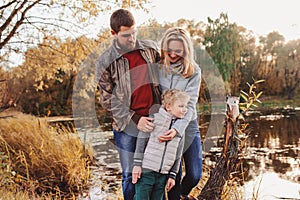 Happy family spending time together outdoor. Lifestyle capture, rural cozy scene