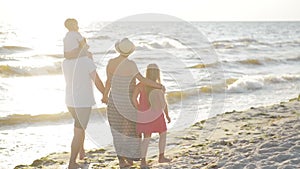 Happy Family Spending Time Together During Summer Vacation on the Seaside.