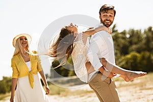 Happy Family Spending Time Together Walking Outdoors On Summer Day