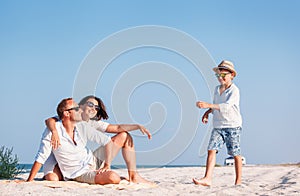 Happy family spent vacation time on the sea coast