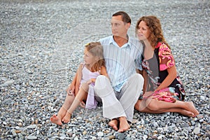 Happy family on stone beach