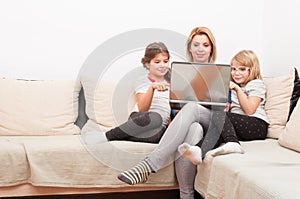 Happy family surfing or browsing internet together