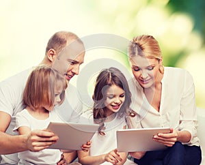 Happy family with tablet pc computers
