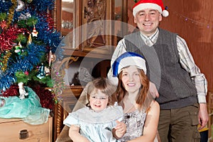 Happy family of three celebrating Christmas