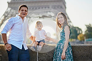 Happy family of three enjoying their vacation in Paris