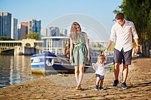 Happy family of three enjoying their vacation in Paris