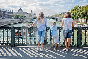 Happy family of three enjoying vacation in Paris, France