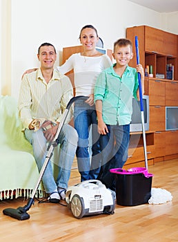 Happy family of three finished housework