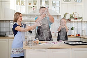 Happy Family of Three Having Fun While Cooking