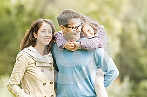 Happy family of three having fun outdoor. photo