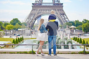 Happy family of three in Paris