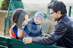 Happy family of three in Paris near the Eiffel tower