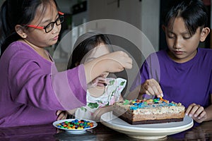 Happy family with three sibling celebrating birthday in quarantine time, self-isolation and family values, stay home, restriction