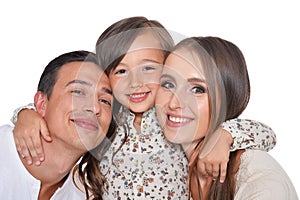Happy family of three smiling and hugging on white background