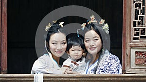 Happy family time, Chinese woman in Hanfu dress with baby girl