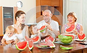 Happy family together with watermelon